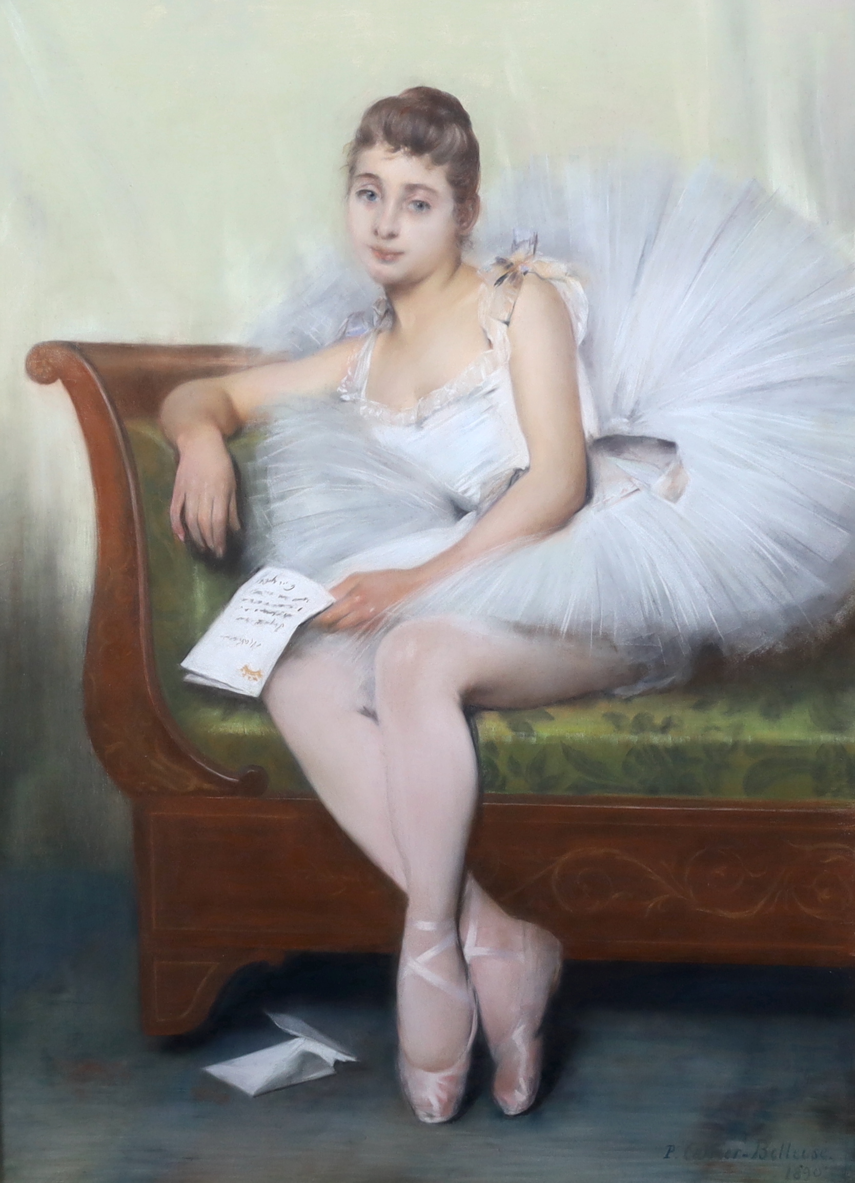 Pierre Carrier-Belleuse (French, 1851-1932), Portrait of a young ballerina seated upon a couch, holding a letter, pastel, 99 x 71cm